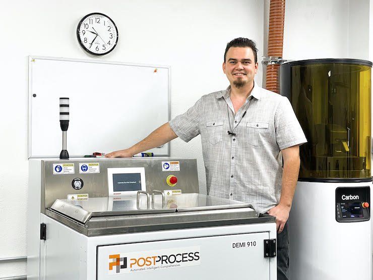 Dinsmore Inc.'s Carbon Lab Supervisor Kirill Tulinov pictured with the PostProcess DEMI 910".