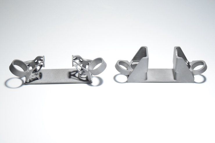 A comparison of the AM-designed bracket (left) and the traditional version (right).