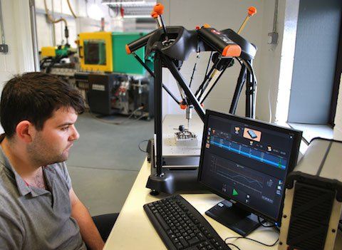 David Powell, Quality Manager at Euromould Ltd using the Equator to gauge parts.