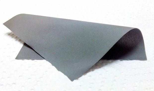 Thin, laser-sintered fluoropolymer sheet (Tm ~ 300ºC) showing good flexibility.