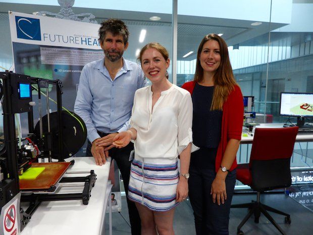 FutureHear team      Dr. Sean Powell, Maureen Ross, and Associate Professor Mia Woodruff beside the LulzBot TAZ 3D printer. - LulzBot