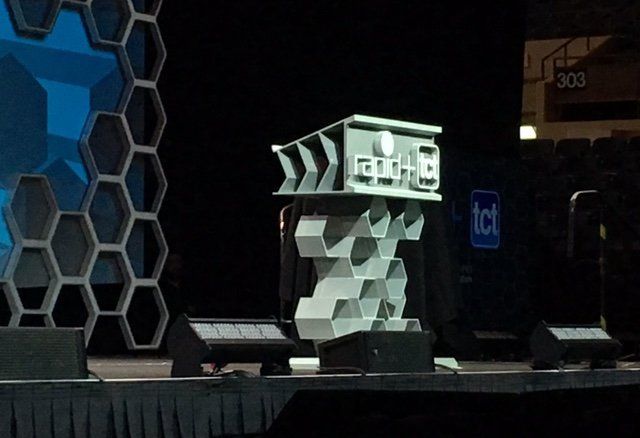 Titan Robotics' 3D printed props on stage at RAPID + TCT.