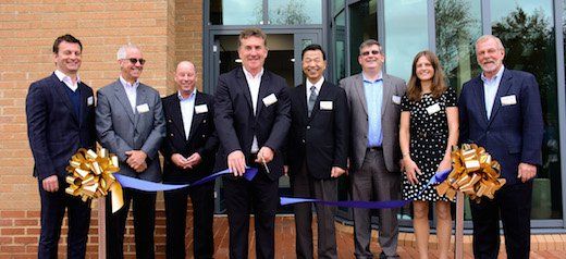 Jerry Davies cutting the ribbon to mark the official opening of Roland DG UK’s new head office and Creative Centre.