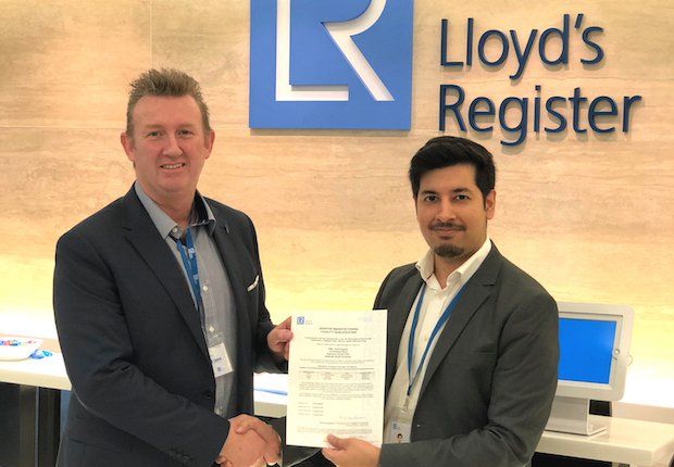 Andy Sales, AML Managing Director, receives the LR-endorsed AM facility qualification certificate from Hussain Quraishi, LR Strategic Projects Lead.