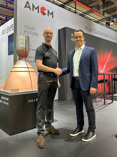 Martin Bullemer, Managing Director of AMCM, left, and Brian Neff, Founder & CEO of Sintavia, right. - AMCM