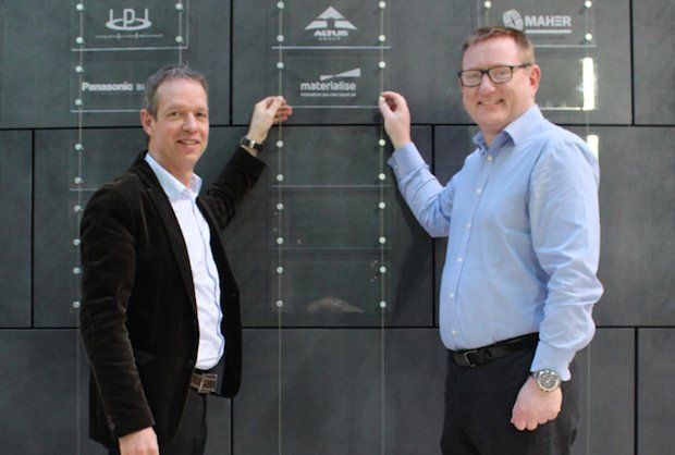 Materialise UK MD Philip Hudson and Materialise executive vice president Bart Van der Schueren add plaque to MTC members’ wall.