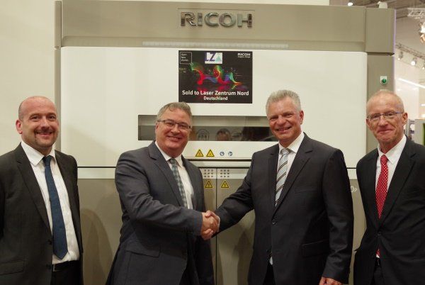 LZN adopts Ricoh 3D Printing technology      Pictured left to right: Greg Plowman, Director, European AM Business Group, Ricoh Europe, David Mills, CEO, Ricoh Europe, Professor Dr.-Ing. Cl...