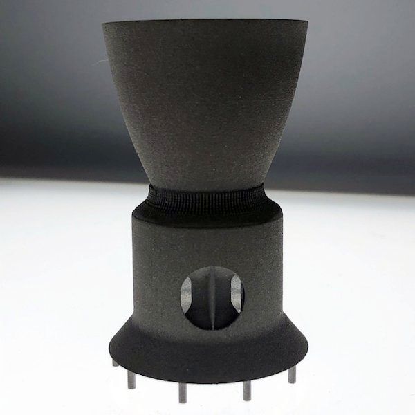 A non-eroding throat insert for a solid rocket motor nozzle made with spherical tungsten-rhenium from 6K Additive.