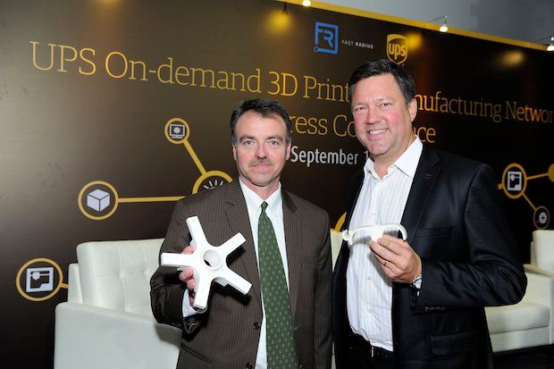 Ross McCullough, President of UPS Asia Pacific Region, and Rick Smith, Co-Founder and CEO of Fast Radius with of 3D printed samples.
