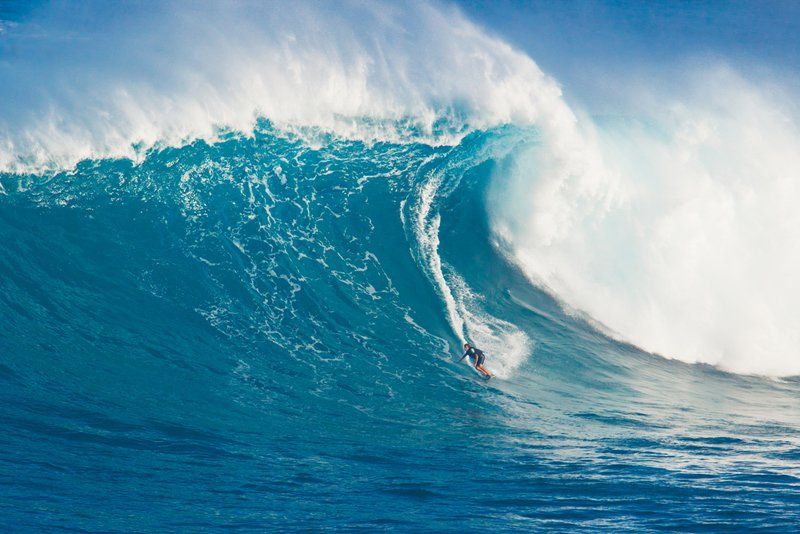 Riding the wave      Professional surfer Billy Kemper rides a giant wave at the legendary big wave surf break known as "Jaws" during one the largest swells of the winter March 13, 2011 in ...