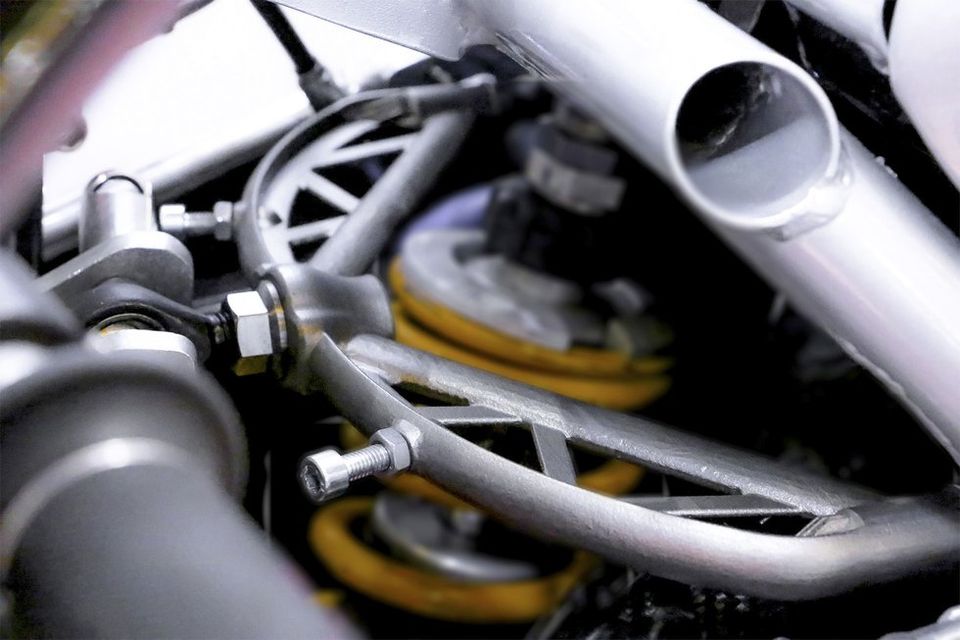 Wishbone in place on bike's suspension      The 3D printed wishbone in place on the Moto2's suspension.