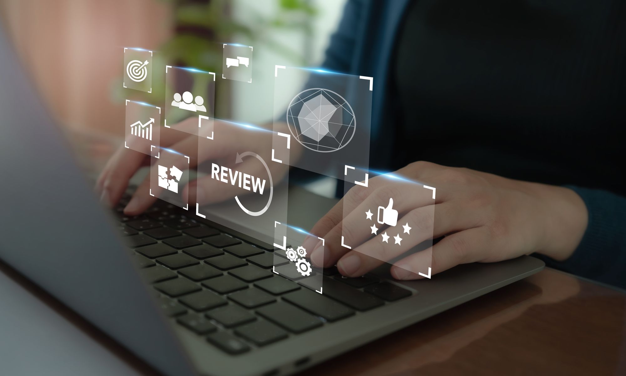 An agents uses an advanced AI tool on their laptop to input multiple data fields for a summary.