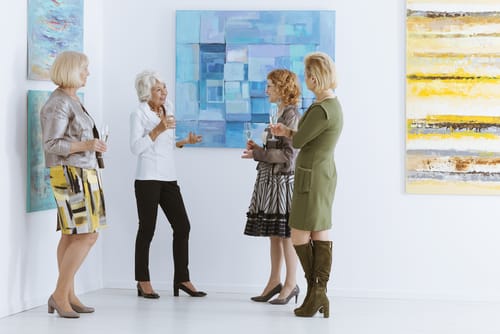 Women socializing at an art event