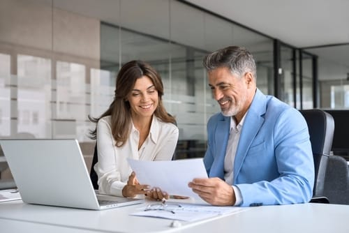 Two Agents Discussing What is on the Papers in Front of them