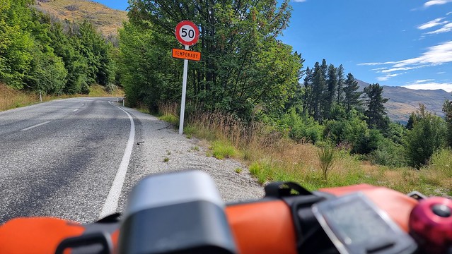 The Coronet Peak Road climb begins