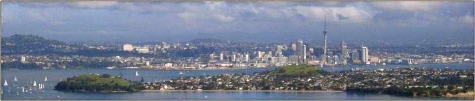 City harbour view scene of Auckland with broken cloud and blue skies