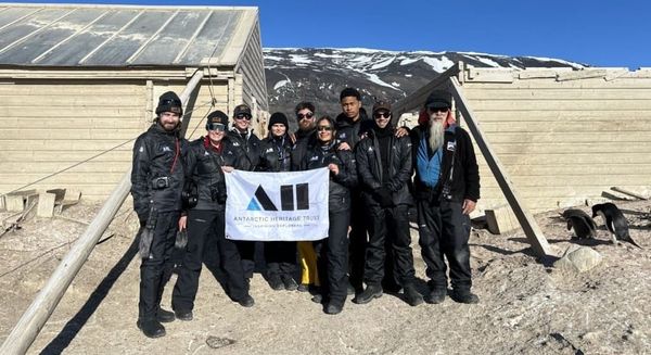 The team outside Borchgrevink's hut | Image credit: AHT/Anna Clare NZAHT.org 77 Degrees South Podcast