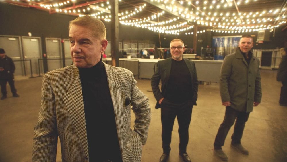 Three Italian men in blazers.