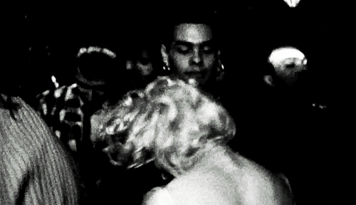 Madonna dancing in a night club.