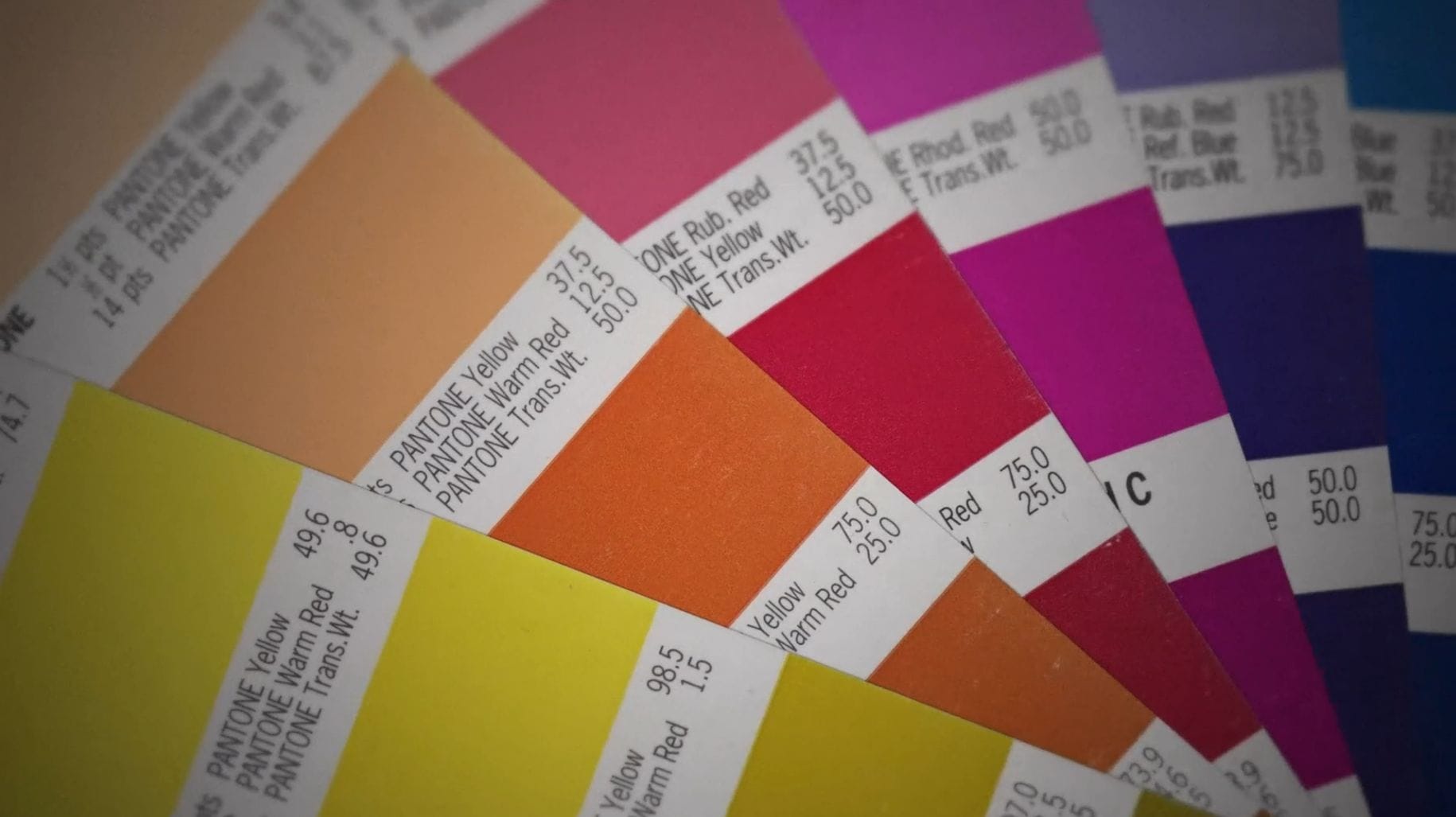 A collection of colour swatches from yellow to orange to red to pink to purple to blue.