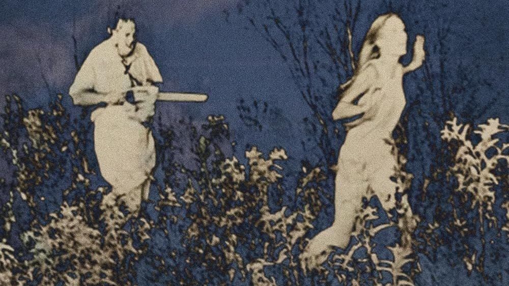 Stylised film still of the texas chain saw massace of a man holding a chainsaw chasing a young woman.