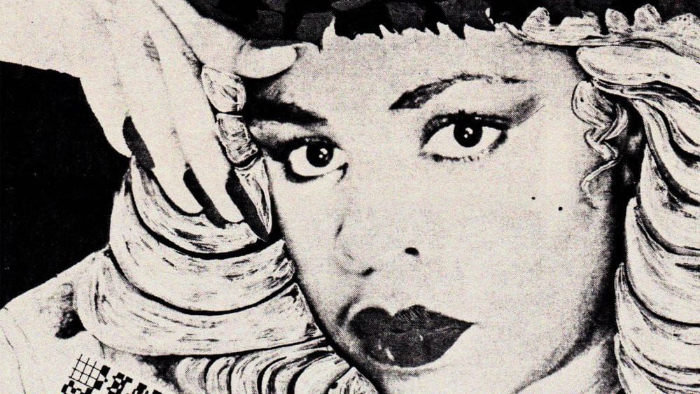 A stylised black and white photo of Diane Luckey aka Q Lazzarus.