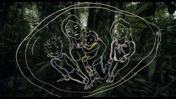Four children draw in white outline with colourful streams of yellow and blue emerge out of a real jungle rainforest.