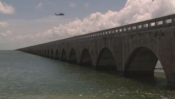 The Seven Mile Bridge from Little Duck Key, Florida. Sequential arches extend out over the water.