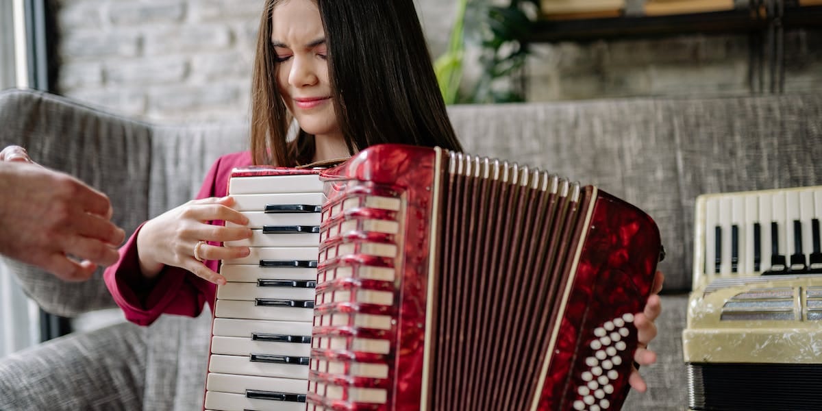 A girl playing an accordian