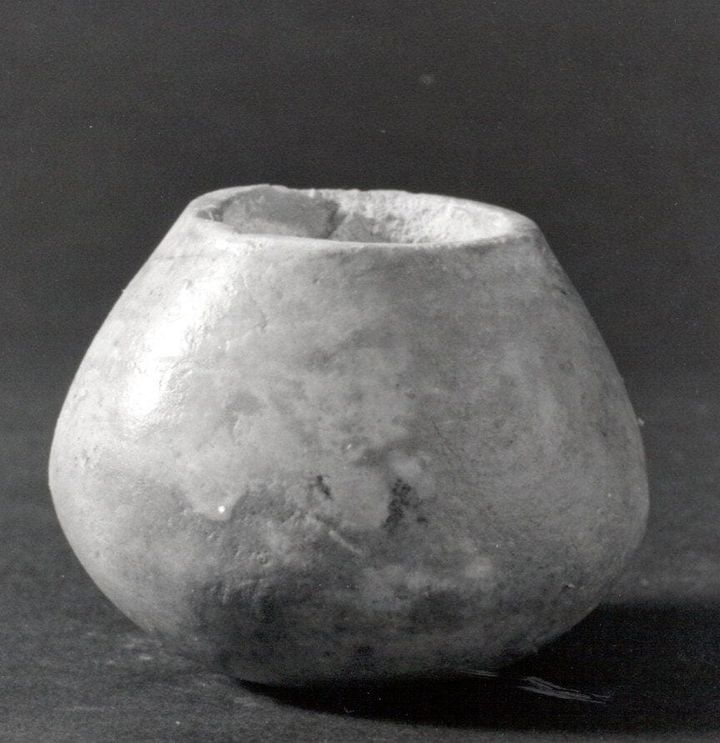 Black and white image of an old stone vessel from the neolithic era