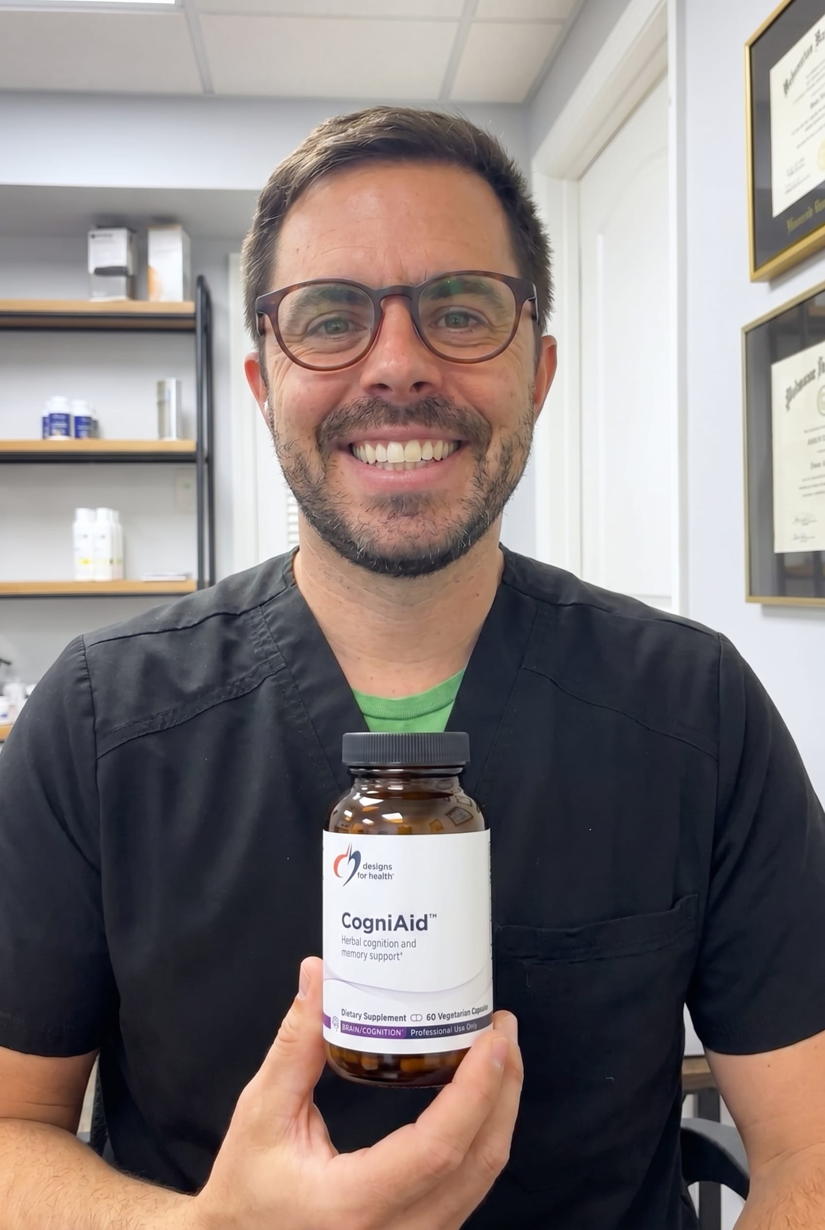 Dr. Bell holding CogniAid
