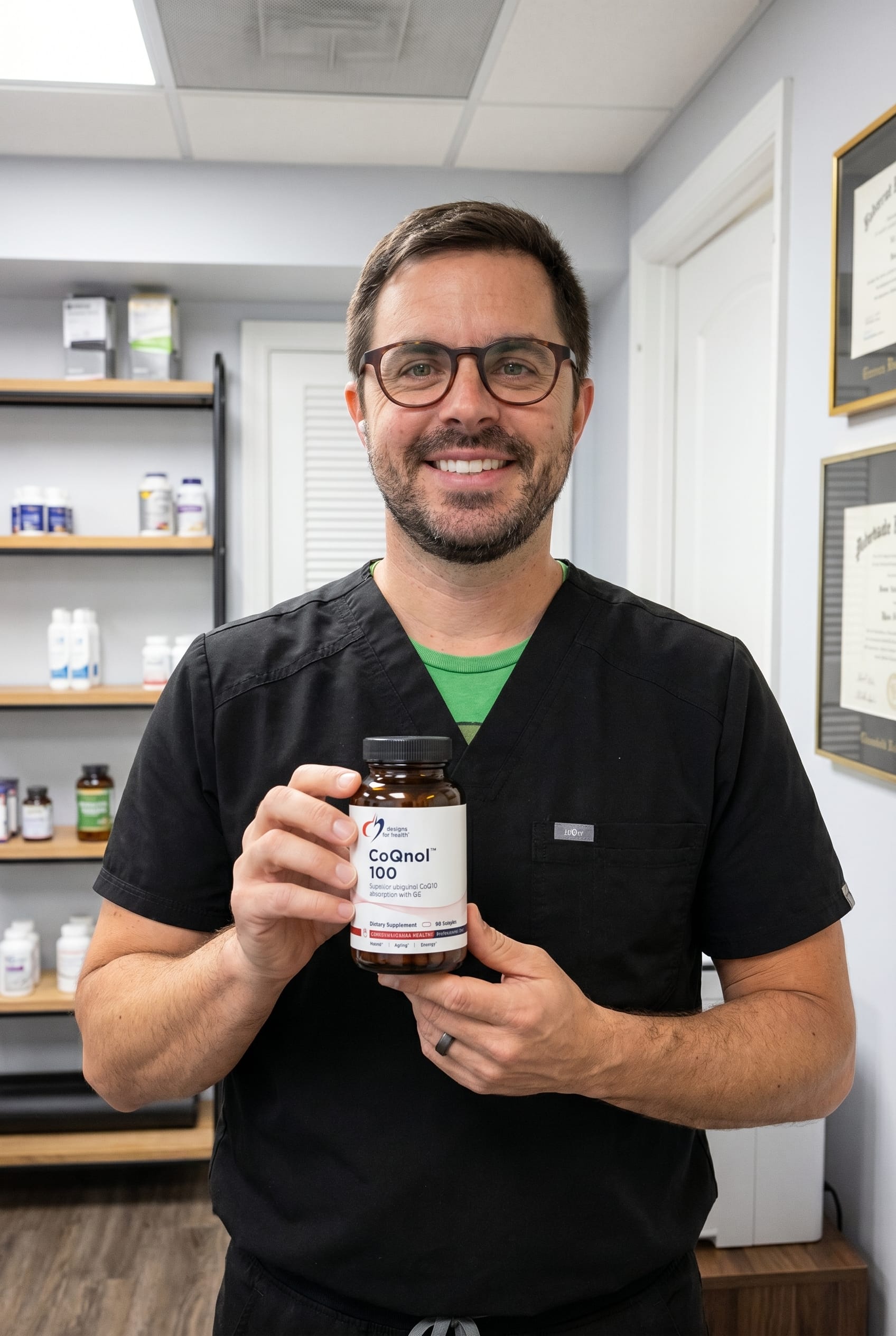 Dr. Bell holding coqnol-ubiquinol-100mg