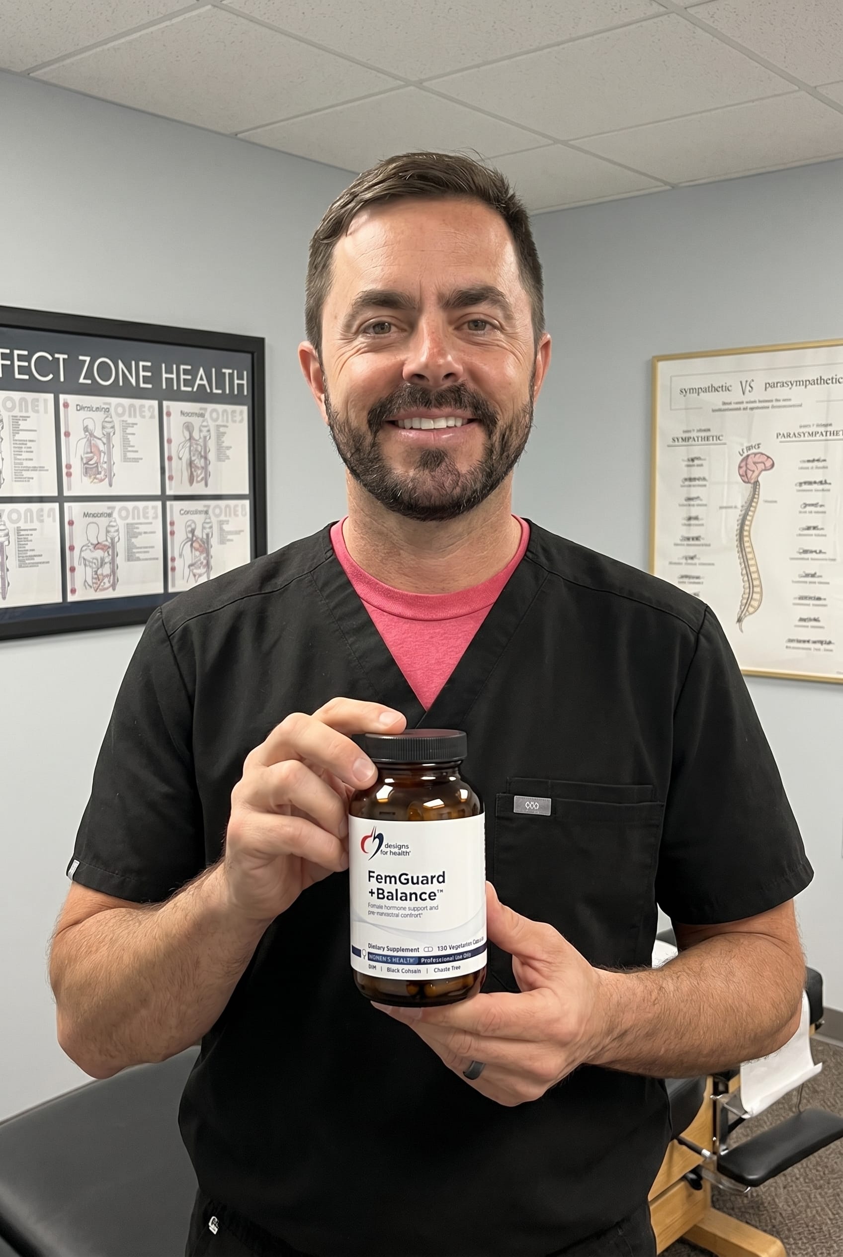 Dr. Bell holding FemGuard + Balance