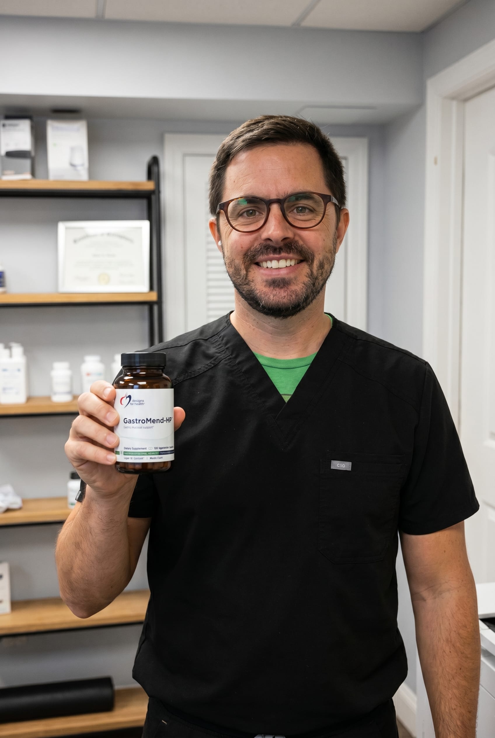 Dr. Bell holding GastroMend-HP