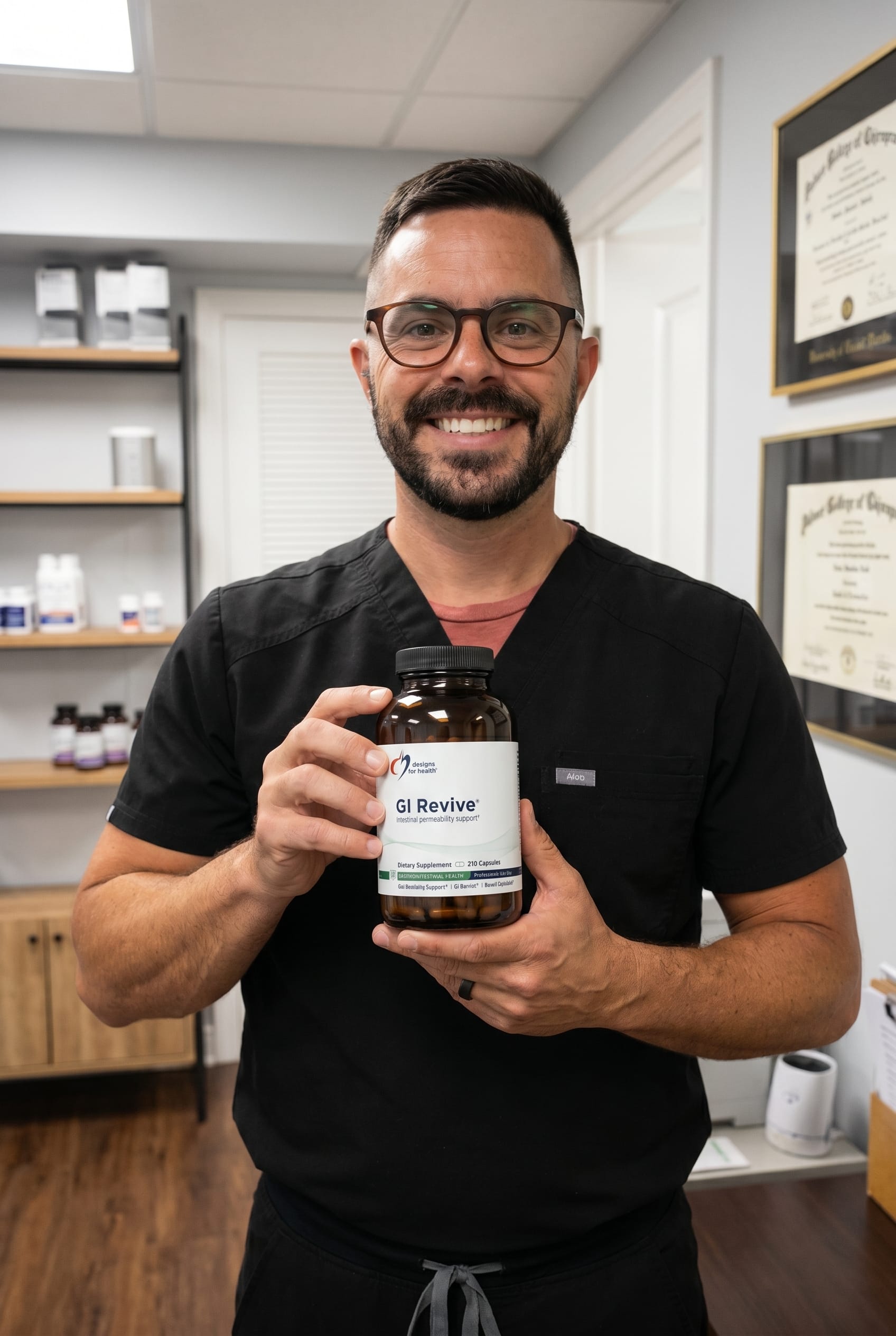 Dr. Bell holding GI Revive Capsules