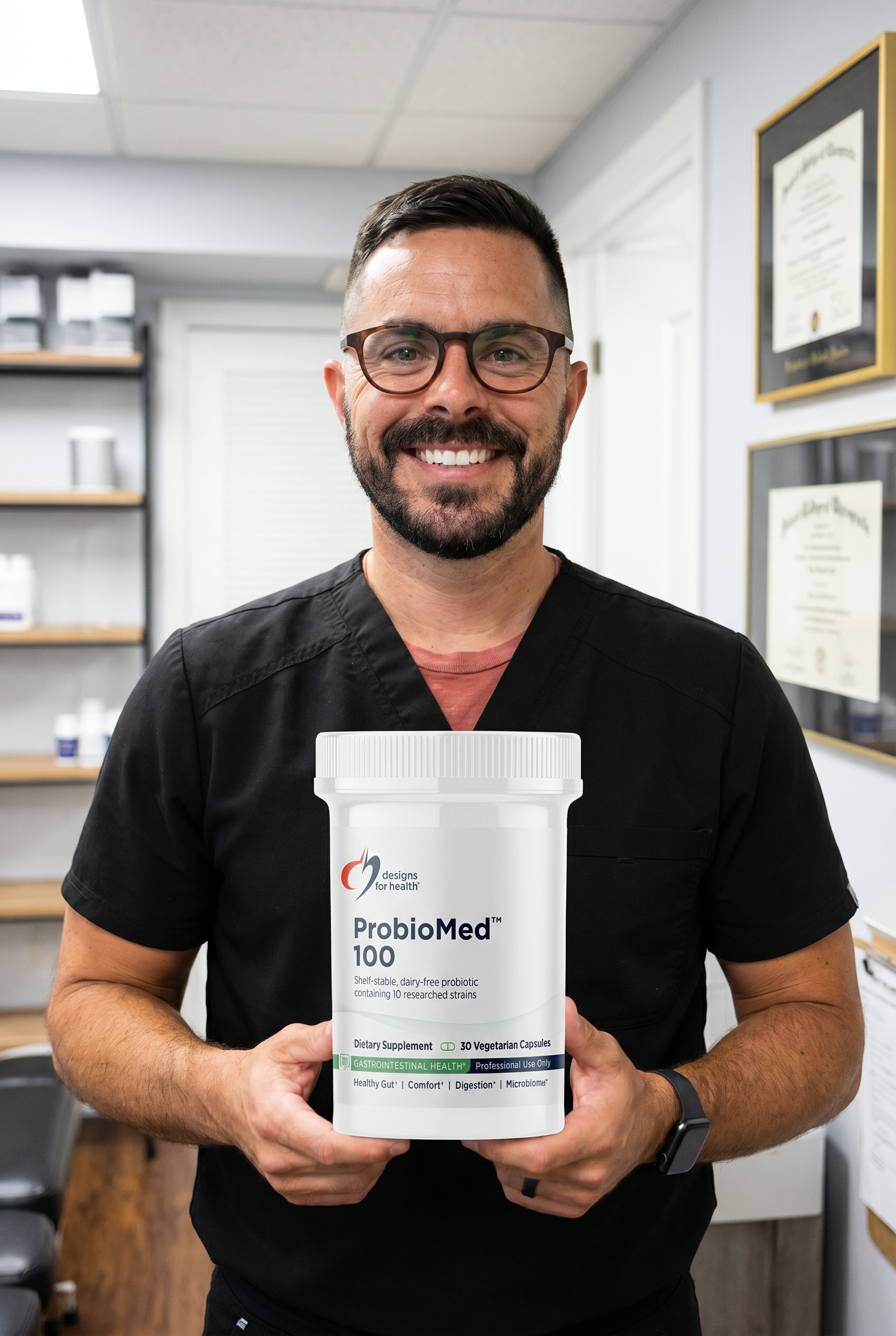 Dr. Bell holding probiomed-100