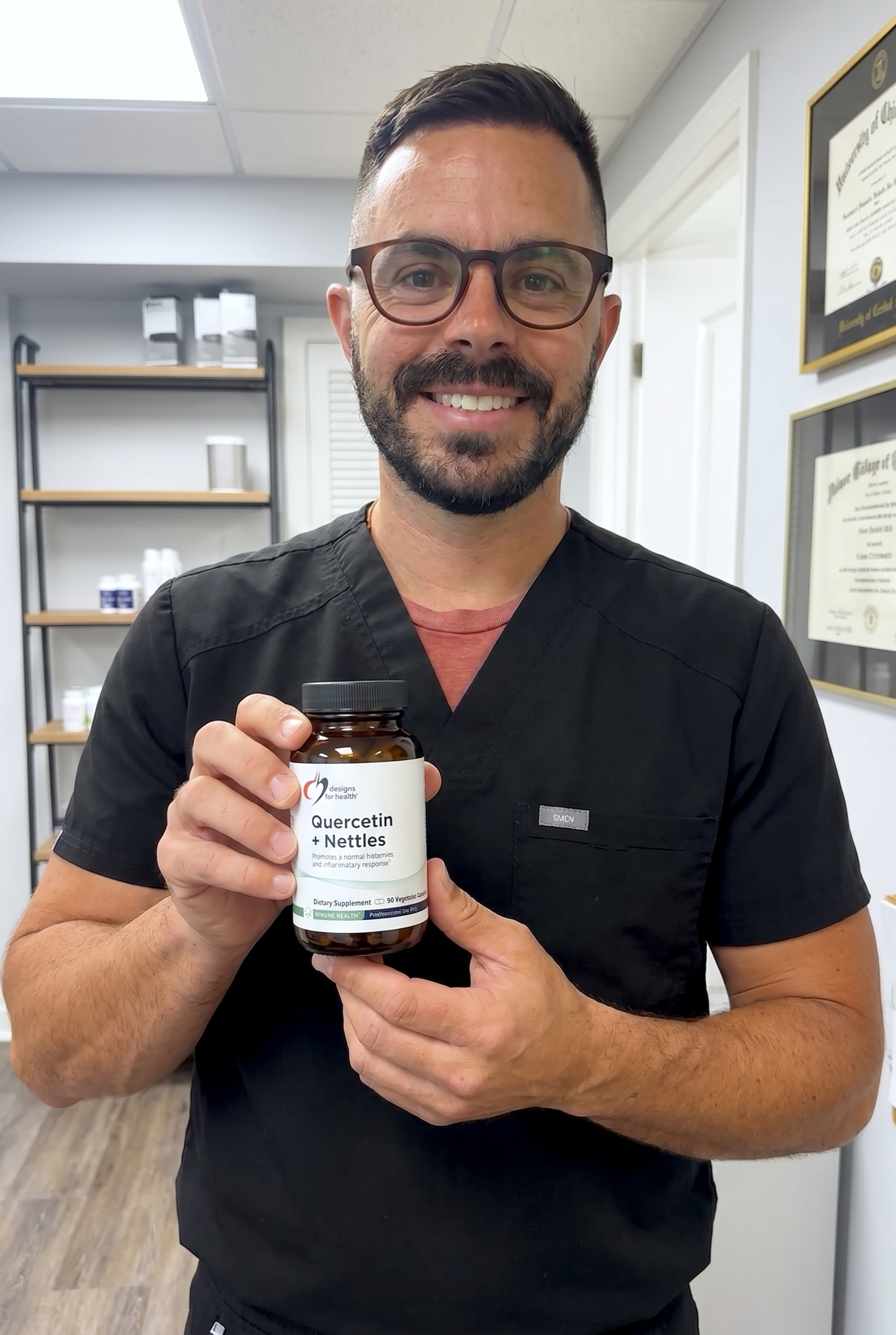 Dr. Bell holding Quercetin + Nettles