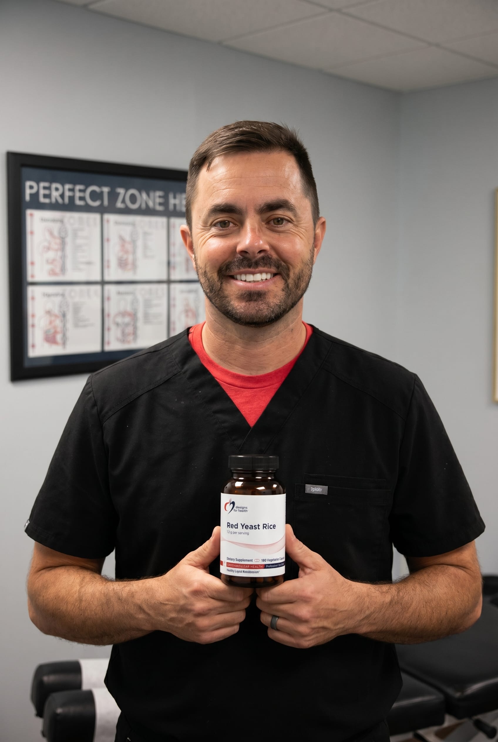 Dr. Bell holding Red Yeast Rice
