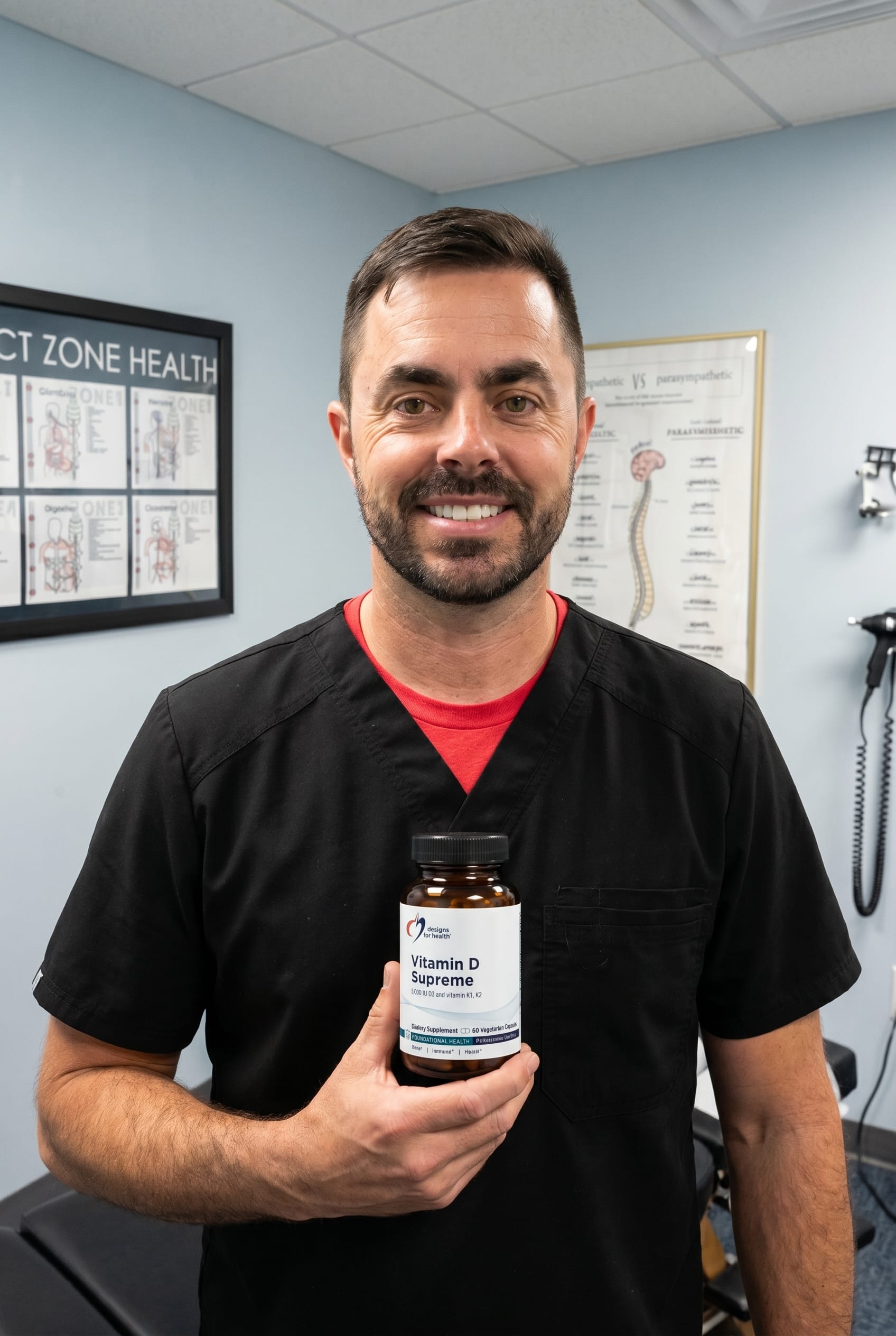 Dr. Bell holding Vitamin D Supreme