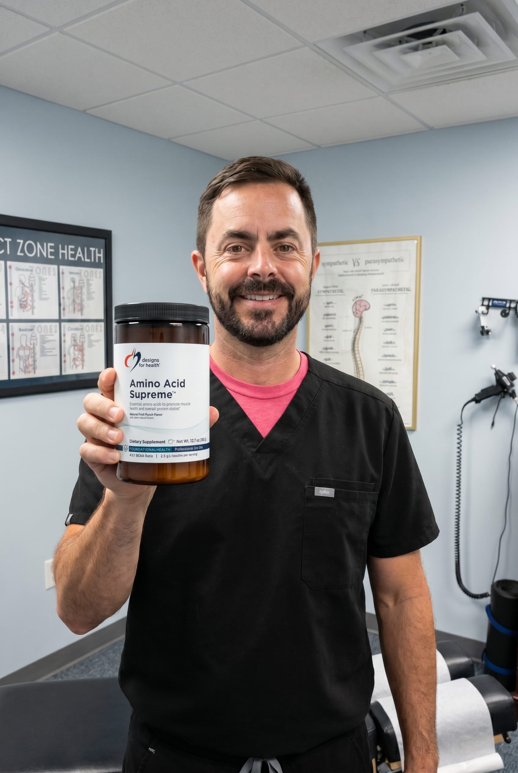 Dr. Bell holding amino-acid-supreme
