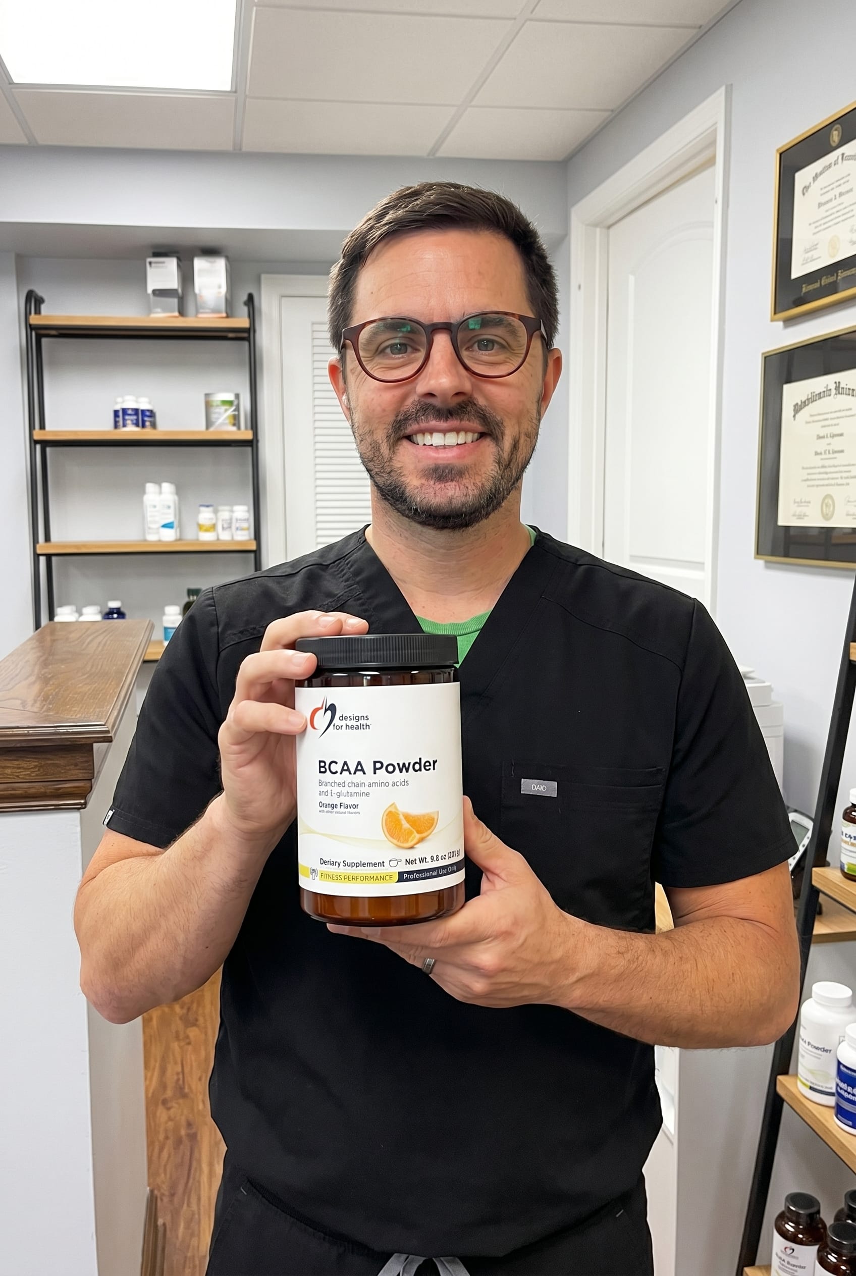 Dr. Bell holding bcaa-powder-with-l-glutamine