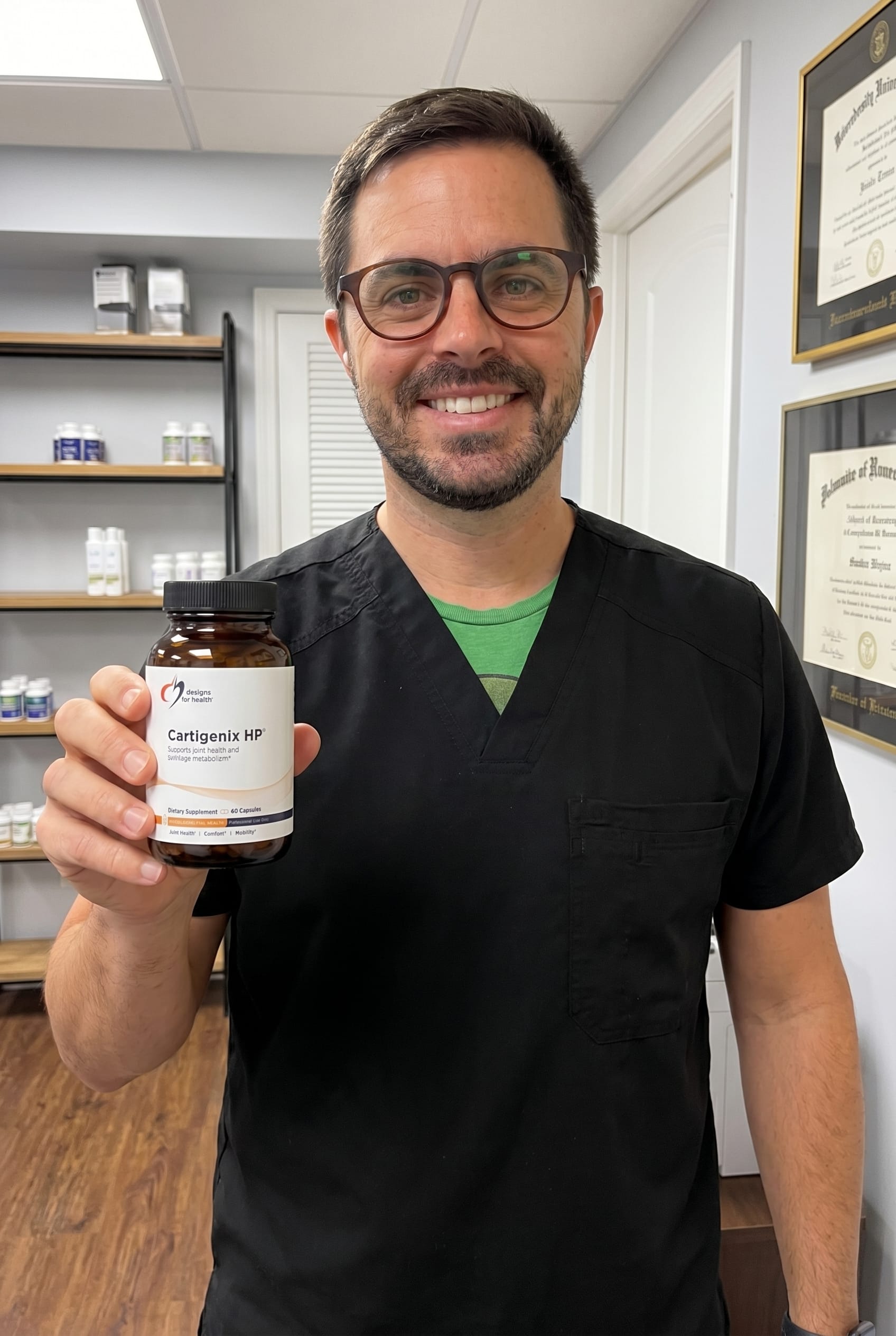 Dr. Bell holding Cartigenix HP