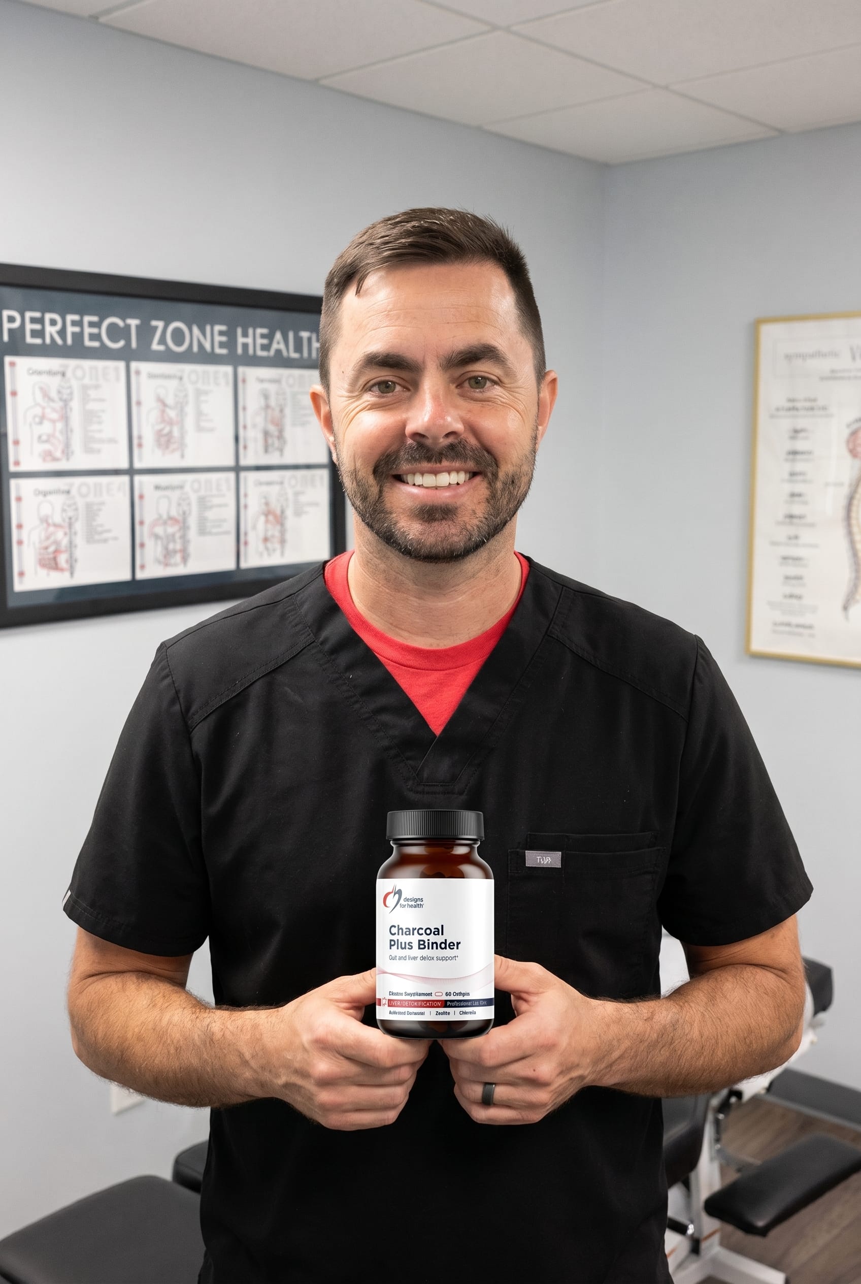 Dr. Bell holding Charcoal Plus Binder