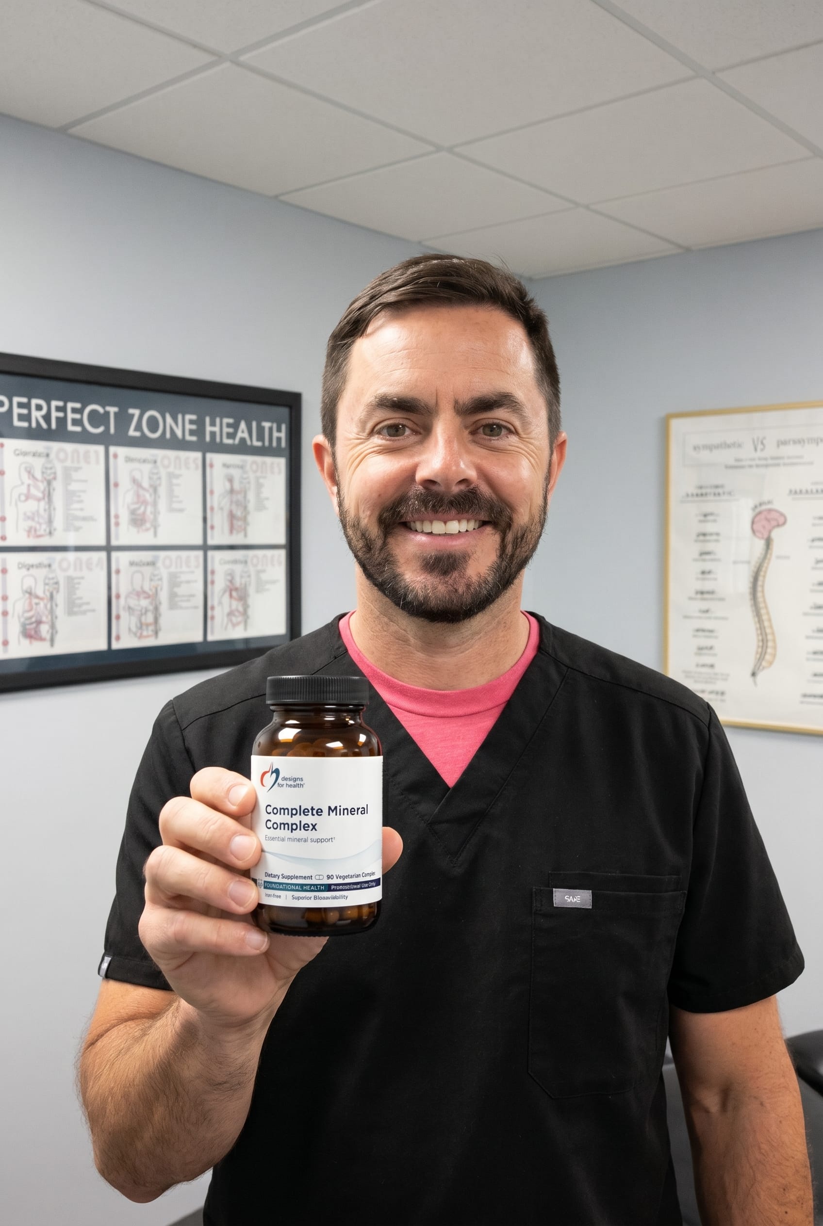 Dr. Bell holding Complete Mineral Complex