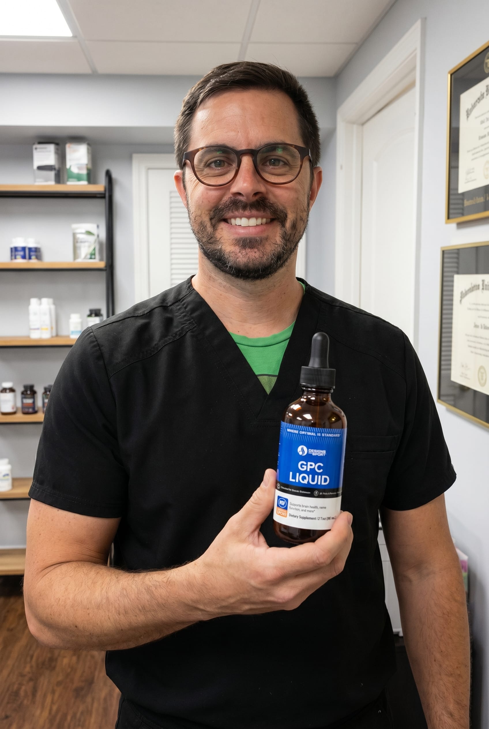 Dr. Bell holding GPC Liquid