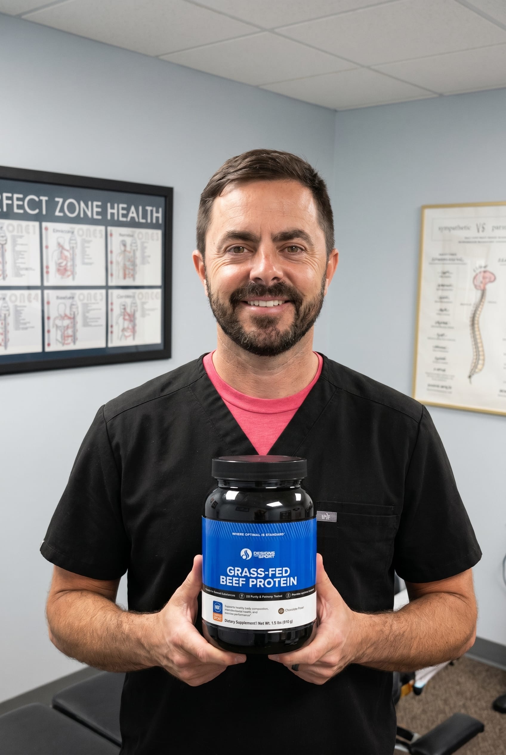 Dr. Bell holding Grass-Fed Beef Protein
