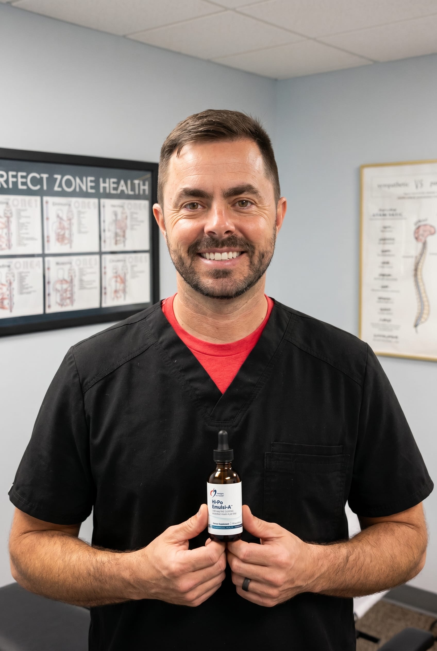 Dr. Bell holding Hi-Po Emulsi-A
