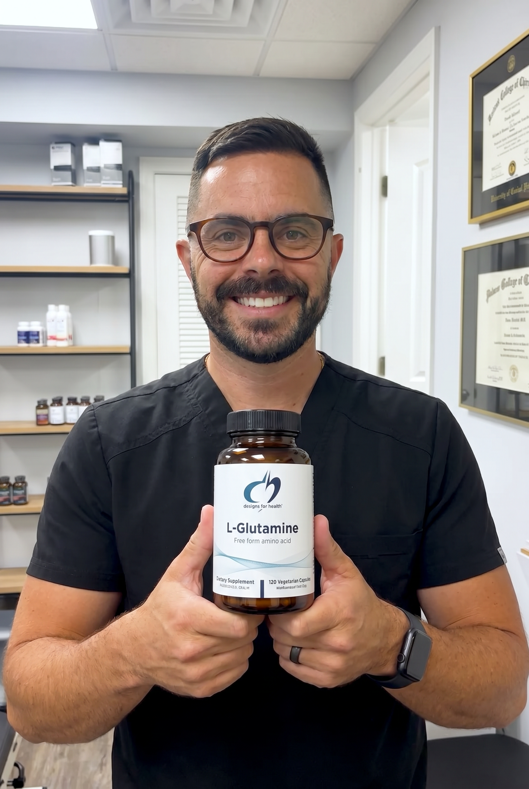 Dr. Bell holding l-glutamine-capsules