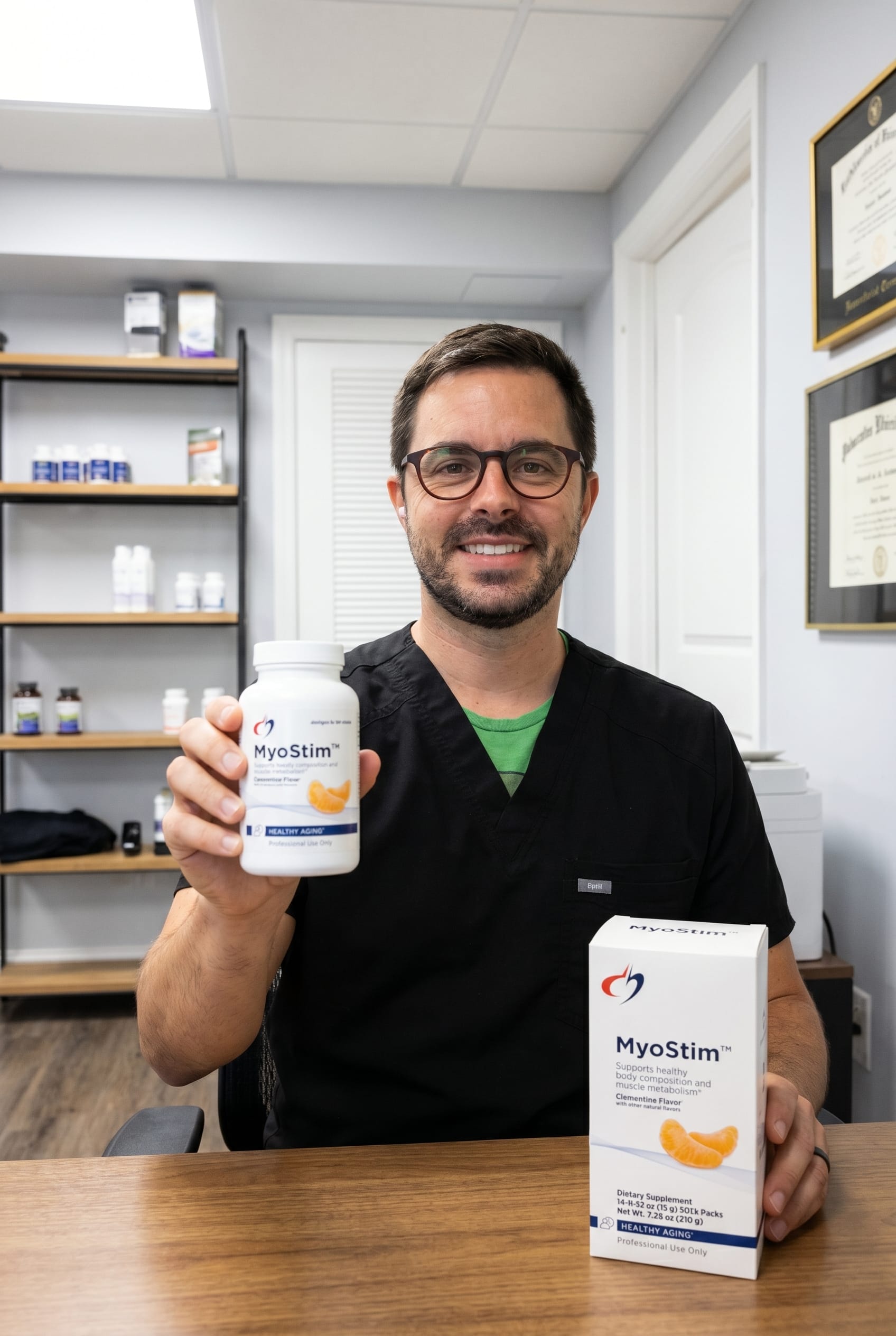 Dr. Bell holding MyoStim