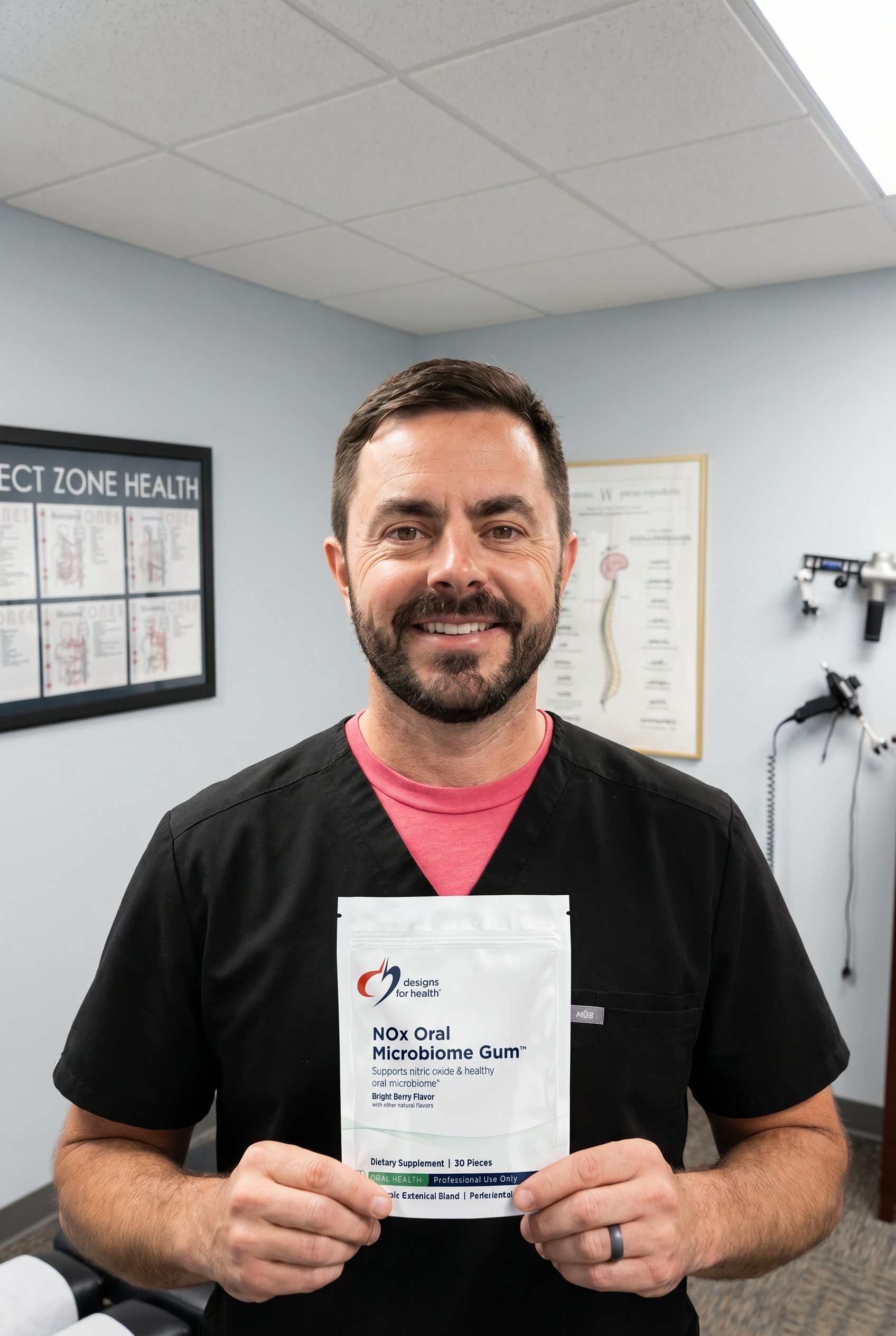 Dr. Bell holding NOx Oral Microbiome Gum